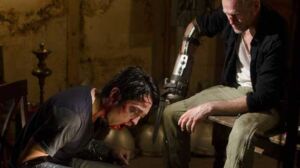 Merle tortura Glenn no S03E07 de The Walking Dead