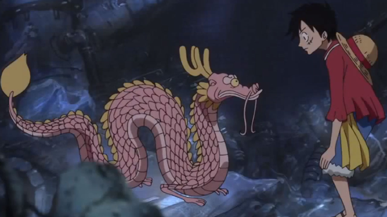 Momonosuke em sua forma dragão e Luffy
