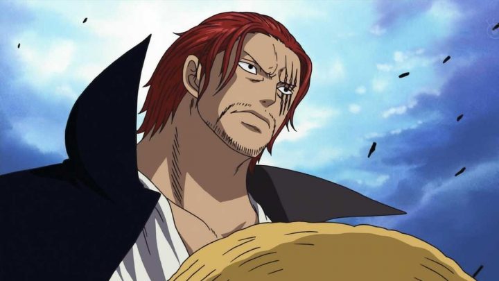 Shanks segurando o chapéu de palha no anime de one piece.